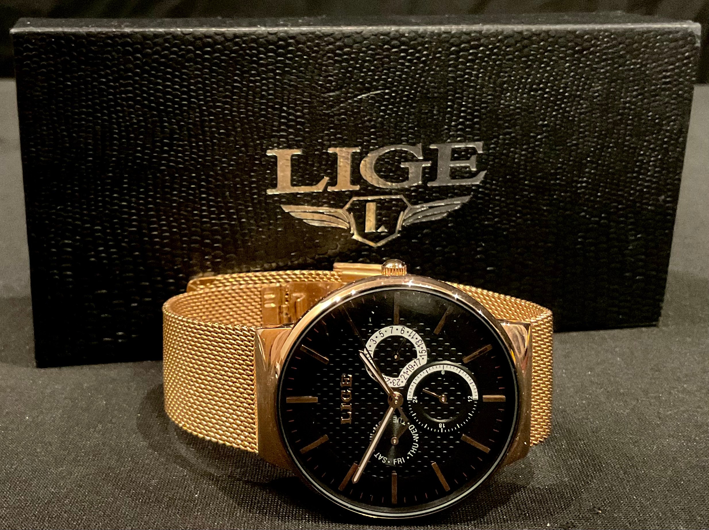 A Lige multi dial watch, original box and papers