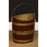 A brass bound coopered mahogany peat bucket or fuel bin, 48cm high over handle, 32cm wide, 26.5cm