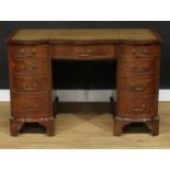 A Bevan Funnell Reprodux mahogany serpentine desk, in the George III taste, 75.5cm high, 115.5cm