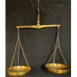 A pair of Maltese brass hanging balance scales, embossed and impressed with weights and measures,