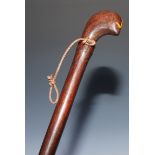 Tribal Art - a hardwood staff, probably Indonesian, stylised bird head pommel, the shaft carved with