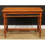 A late Victorian oak primary centre table, rectangular top with moulded edge above a spindle-