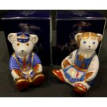 A Royal Crown Derby paperweight, Schoolboy Teddy, gold stopper, boxed; another, Schoolgirl Teddy,