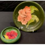 A Moorcroft Hibiscus pattern shallow circular bowl and a Moorcroft small cabinet plate (2)