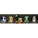 A set of four Baccarat glass paperweights, each with Royal family cameo; a duck paperweight (5)