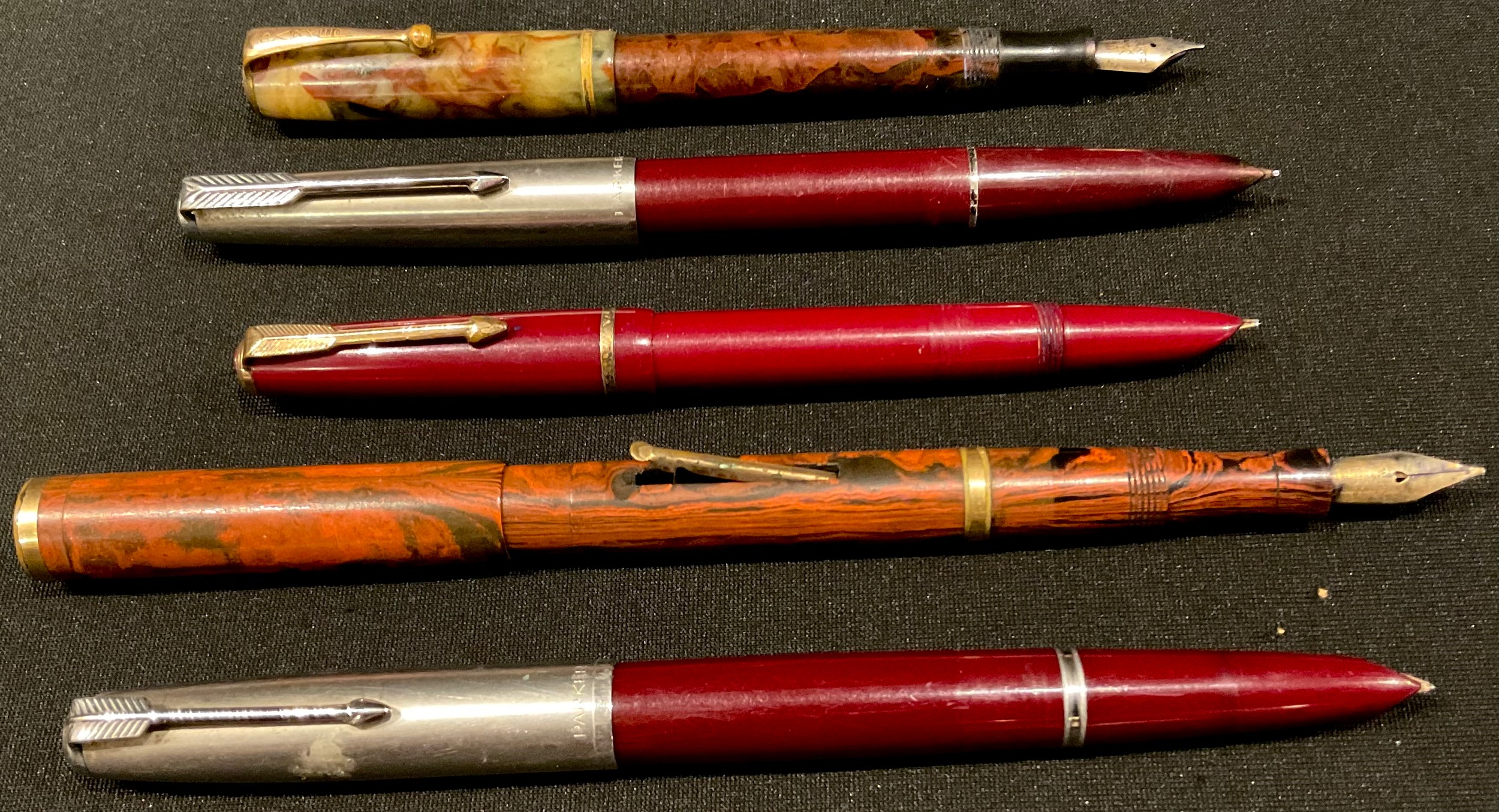 An early 20th century Parker fountain pen, 14k gold nib; a similar Swan fountain pen, number 2, 14ct