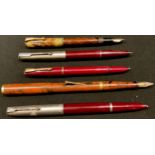 An early 20th century Parker fountain pen, 14k gold nib; a similar Swan fountain pen, number 2, 14ct