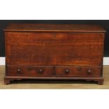 A George III oak mule chest, hinged top enclosing a till, above two short drawers, skirted base,