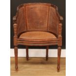 A late 19th/early 20th century French bergère desk chair or fauteuil, double-caned back, 78.5cm