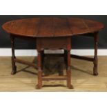 An 18th century oak gateleg table, oval top with fall leaves, turned supports, 71cm high, 45cm