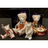 A Royal Crown Derby paperweight, Drummer Bear, gold stopper, boxed; another, Blue Bow Tie Bear,