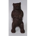 An early 20th century cast iron novelty money box, as a bear, 16.5cm high