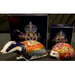 A Royal Crown Derby paperweight, Moonlight Badger, gold stopper, boxed; another, Orchard Hedgehog,