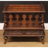 A late Victorian oak three-section Canterbury, drawer to frieze, 53cm high, 61cm wide, 41cm deep