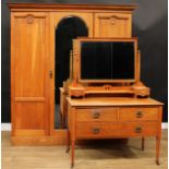 An Arts & Crafts period oak two-piece bedroom suite, comprising wardrobe, 208cm high, 190cm wide,