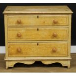 A Victorian scumbled and painted chest, rectangular top above three long drawers, turned handles,