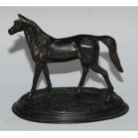 A Continental dark patinated desk sculpture, cast as a horse, oval base, 13.5cm high