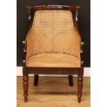 A William IV style simulated rosewood bergère library chair, 91cm high, 60cm wide, the seat 53cm