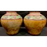 A pair of ovoid Royal Doulton vases, monogrammed by Lily Partington, tube lined with a band of
