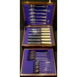 A mid-20th century six place setting of Sheffield EP flatware, in a folding canteen with drawer