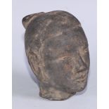 A Chinese stone sculptural fragment, carved as the head of a young man, 11cm long