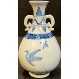 A Chinese two handled blue and white bottle vase, painted with birds, stiff leaf borders, 18cm,