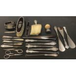 Victorian and later silver hafted button hooks and shoe horns; a silver cased pocket manicure set,