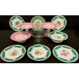A mid 19th century Staffordshire part dessert service, painted with flowers, gilded green borders; a