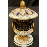 An early 19th century Derby two handled campana shaped pot pourri vase and cover, gilt decoration on