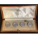 A set of four gentleman's gold and mother-of-pearl dress buttons, each marked 18ct and 9ct, cased