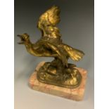 A 19th century gilt bronze desk weight, of a bird, with outstretched wings and beak open, rounded