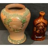 A 19th century salt glazed snuff jar, 22cm high; a treacle glazed flask, Queen Victoria and