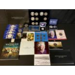 A collection of commemorative UK coins, to include: Waterloo 200 Collection: booklet, folder and