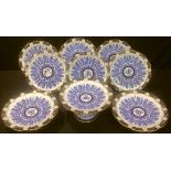 A Coalport Aesthetic Movement nine piece dessert service, gilded blue and white decoration with