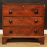 A George III provincial mahogany bachelor’s chest, crossbanded caddy top above a slide and three