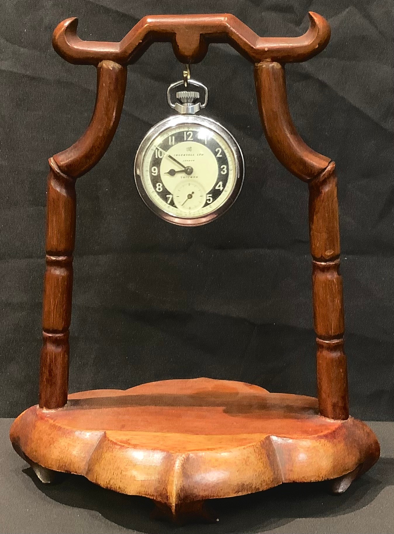 A Chinese hardwood pocket watch stand, 22cm high