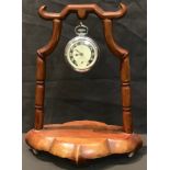 A Chinese hardwood pocket watch stand, 22cm high