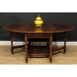 An 18th century style oak gateleg dining table, by Titchmarsh & Goodwin, oval top with fall