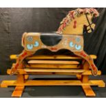 Folk Art - a mid-20th century European painted wooden rocking horse, on safety stand, probably