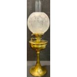 An early 20th century Art Nouveau brass oil lamp, Hinks No.2 Lever, frosted glass globular shade,
