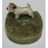 An Austrian cold painted bronze, of a Scottish Terrier, mounted on a green onyx pin dish, 10cm wide