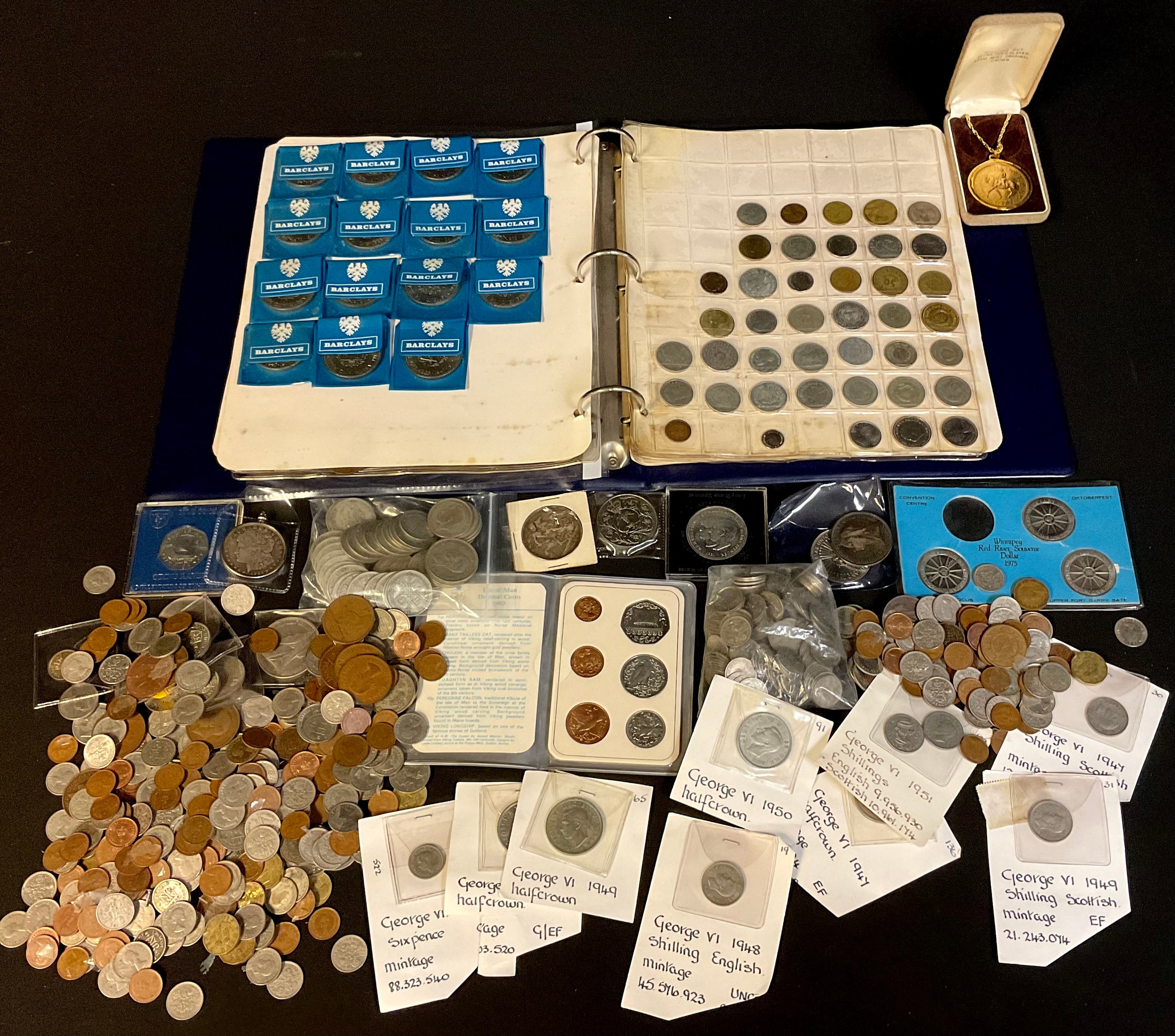 A collection of coins, mostly UK issues, including a ring binder album of UK and foreign base