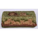 A Victorian needlework brick cover door stop, in coloured wool with a lion and lioness, 23cm wide,