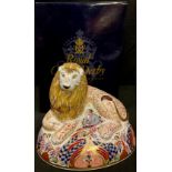 A Royal Crown Derby paperweight, Lion, gold stopper, 15cm high, printed mark in red, boxed