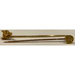 A late 19th century gold fox mask stock pin, diamond chip eyes; another diamond set stick pin,