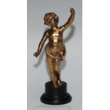 A Continental gilt metal figure, cast as a putto, ebonised base, 17cm high