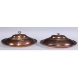 A pair of Middle Eastern copper oval entree dishes and covers, 31cm, wide, marked to interiors,