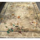 A Chinese wool carpet, worked with bamboo, flowers and leaves, 451cm x 363cm