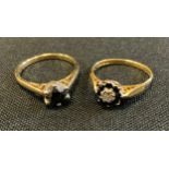 A sapphire and diamond flower head cluster ring, 18ct gold shank, size N, 2.7g gross; a deep blue