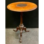 A Victorian walnut tripod table, turned and fluted column, carved cabriole legs, 72cm tall x 50.